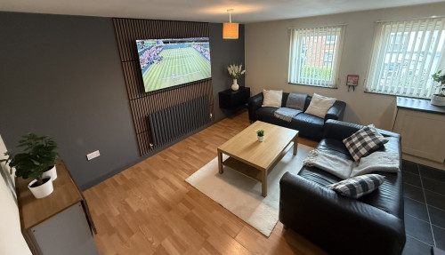 Lounge with media wall at 5 Broom Street